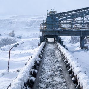 Cold resistant conveyor belt operating in a snow-covered industrial mining environment